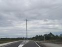 Torreta eléctrica en el primer tramo del vial que enlazará el polígono con la carretera de Razo
